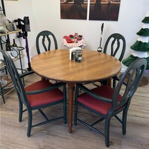 Elegant Wooden Dining Table Set with Green and Red Chairs